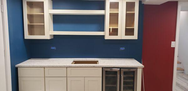 Cabinets and countertop for the  wet bar both by Royal Kitchen and Bath