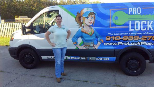 Julie standing by one of our service vehicles.