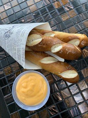 SOFT PRETZEL STICKS & BEER CHEESE- Four cheeses blended with kolsch and warm pretzel sticks.