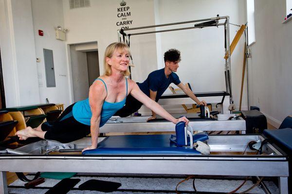 June Hines & Matthew Morfopoulos demonstrating the snake on the reformer