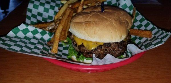 Cheddar cheese burger with fries.