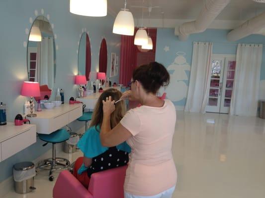 a young client receives treatment for head lice at The Hair Angels, Pasadena Lice Removal Salon