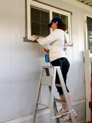 Volunteer Cleaning windows.