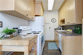 Kitchen with refrigerator, stove, dishwasher and microwave.