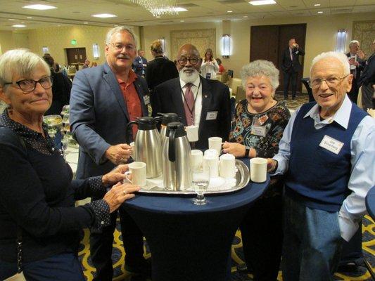 Members enjoying conversation at Coffee Connections before weekly meeting at Park Hotel