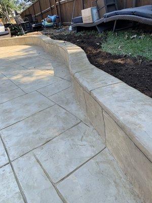 Small retaining wall stamped with bone color