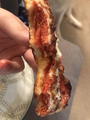 Stacks of pepperoni under the cheese