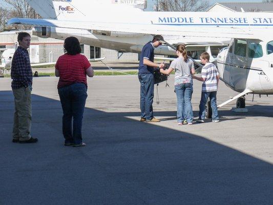 Excited Mom as the kids get ready to fly on a Discovery Flight!