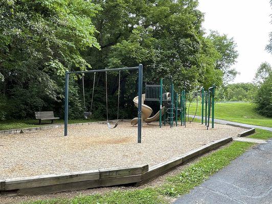 Play Area with Swings and a Bench