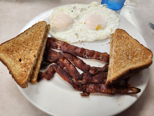 2 over easy, bacon, whole wheat toast