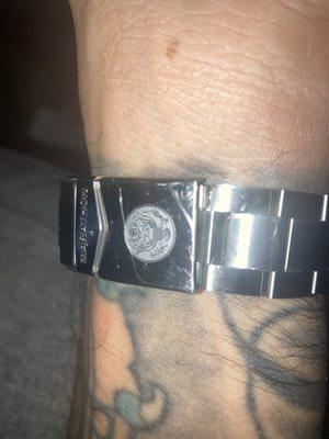 2 scratches on the back of a watch