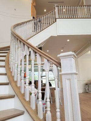 All white oak..rails..cap...post..balusters.. with paint grade skirts