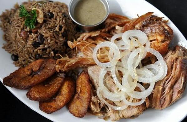 Pernil, Cuban Mojo marinated / roasted pork shoulder. Served with Congri Rice and Sweet Plantains. www.elcubancatering.com