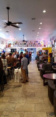 The bar on the left, comfy leather couches and chairs on the right.