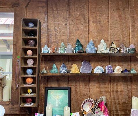 These are some of my favorite shelves in the store. Some have crystal spheres, freeform crystals, and flame crystals as well.