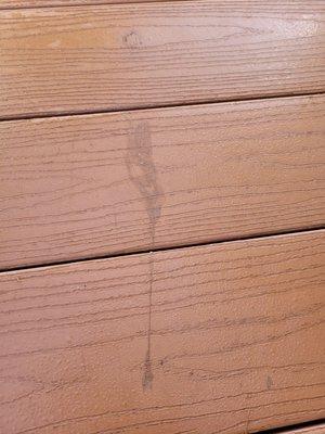 Glue stains on our deck from messy, incompetent technicians