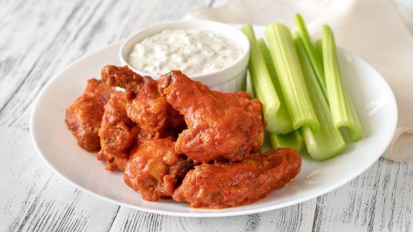 Buffalo chicken wings served with celery and blue cheese or ranch