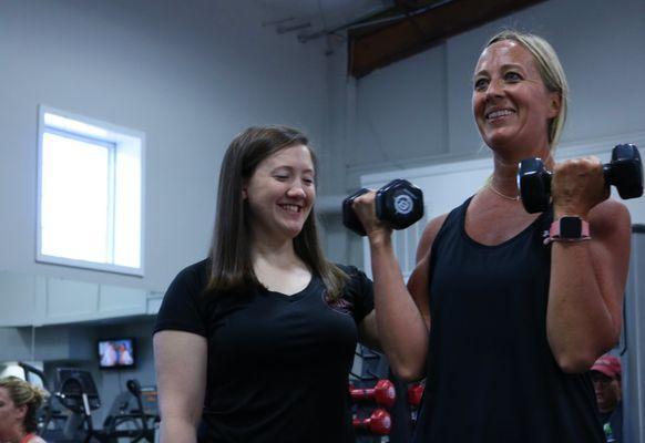 Our personal trainer, Ashley, doing a great job helping improve upper body strength with this fabulous member!