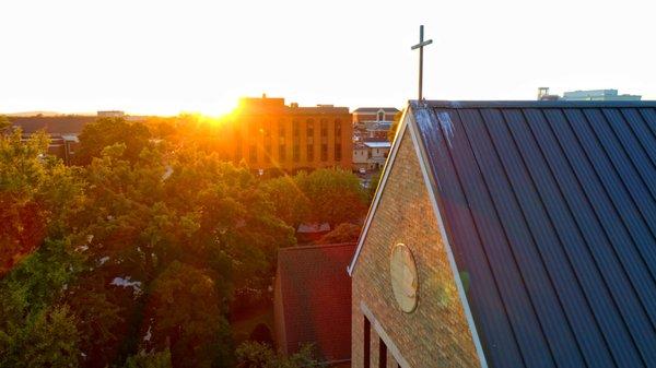 The downtown sunset touching the cross on St. Paul's Episcopal Church.