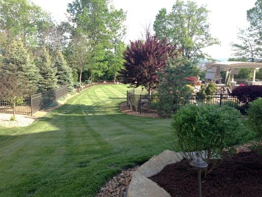 Kissel Landscaping design: mulch and decorative stone beds, retaining walls, seasonal planting, lawn care