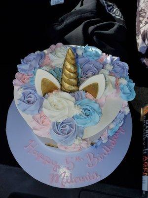 Unicorn cake. White cake...two tiers and strawberries and Bavarian creme inside both layers! I don't even like cake and YUMMMM