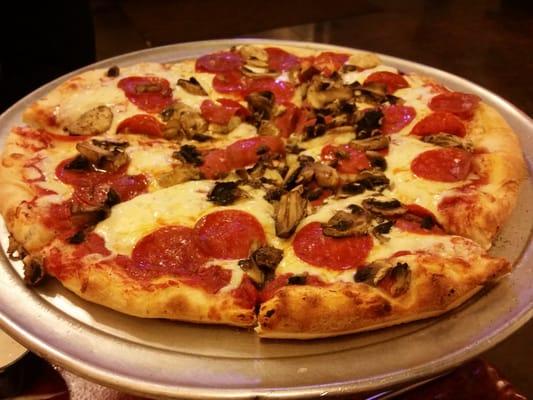 White pizza with pepperoni and mushrooms