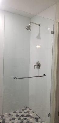 Oversized ( frameless ) shower door with a horizontal towel bar