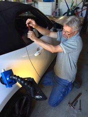 Malcolm ironing out a dent. After he was done it was gone without a trace.