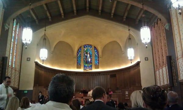 Pulpit view with beautiful stained glass.