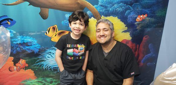 Dr. D with his patient. We love to see our patients with big, happy and healthy smiles!