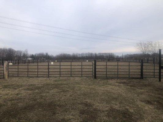 Large, fenced outdoor arena.