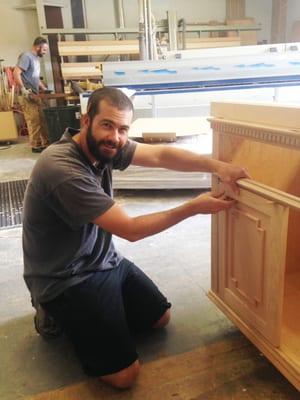 Adam working on a custom bath vanity at Green Leaf Cabinets and Green Goods