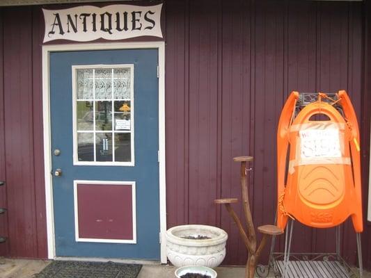 The sign on the sled is supposed to say "we sell sleds".