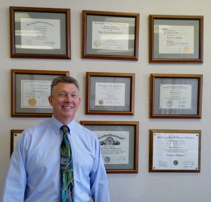 Dr. Knowles with his degrees and certifications.