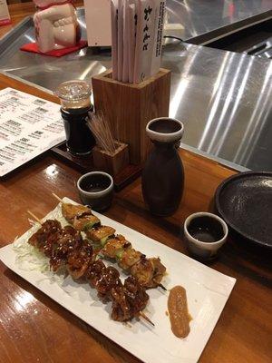 house hot sake, chicken thigh scallion and chicken skin