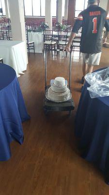 wedding cake assembled on cart