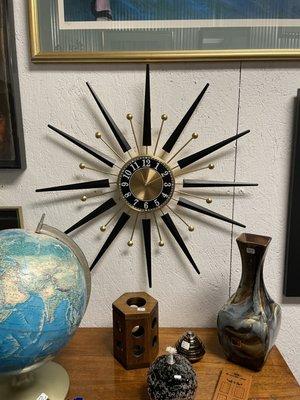 Reproduction starburst clock and originals when they can be found.