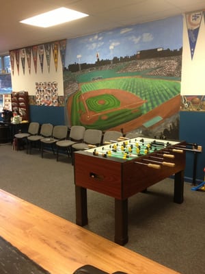 The waiting area and foosball table.