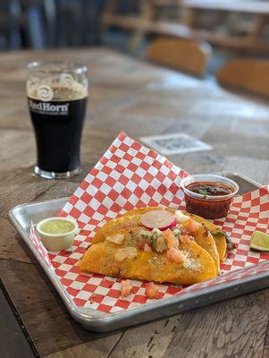 The birria tacos w/ the coffee milk stout in the background