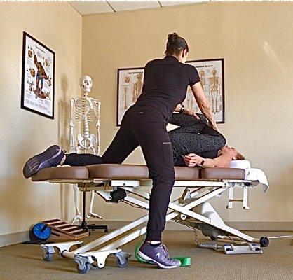 Assisted figure-4 stretch helps to mobilize hips, decompress lower back & glute group, where tightness can aggravate the sciatic nerve.