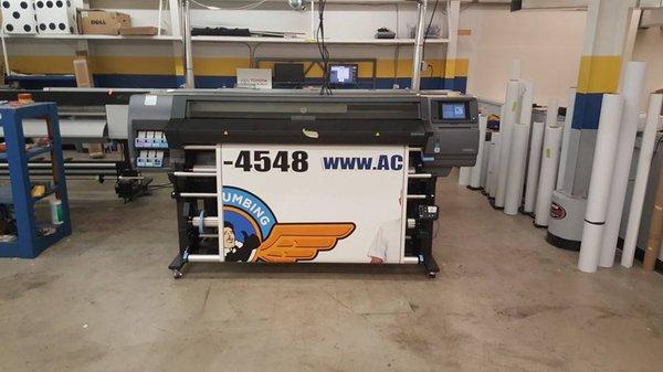 1 of 2 of our HP latex printers printing a wrap for Ace Plumbing. We have the latest printing technology in the industry!