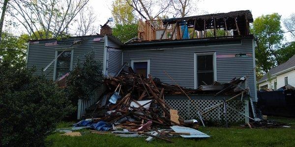 demo that tore up porch , subpar demo not flumed to nearby dumpster broke windows,damaged porch, damaged 120 yr old door, and screen.