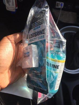 Dental goodie bag with travel size toothbrush, mouthwashes, and floss