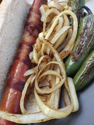 Polish dog whith bacon. Longer 1 ft,1/4 paund,%for% beef. Grilled onion end jalapeños