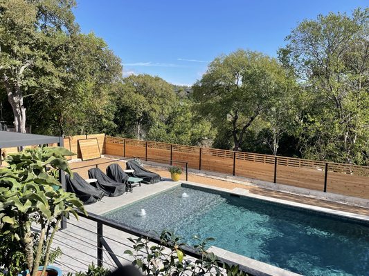 Cedar fence with stainless steel cable system handrail and gates