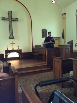 Westerville police officer conducted the tour of Central College Presbyterian Church as part if the bus tour for Field of Heroes