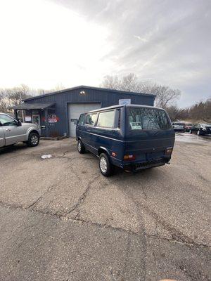 My van out front of the shop after we bleed the coolant hoses and he sprayed the coolant off my van.