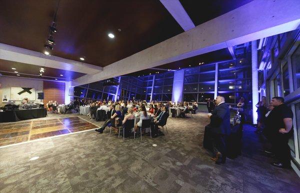 Great blue up lighting during dinner, bride/groom dances, and during the showing of a wedding video (pictured here).