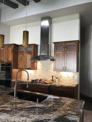 White dimensional tiles installed on this kitchen back splash surround