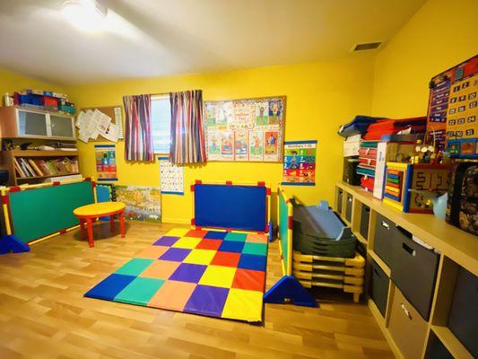 Tumbling and movement is a special part of our day. Roll up the mat and this room is a cozy place to nap.